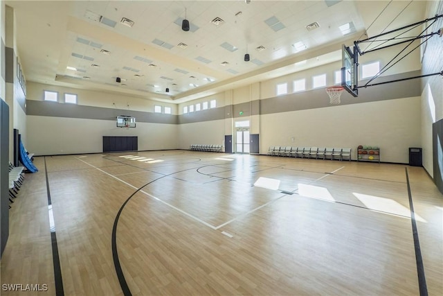 view of sport court with community basketball court and a healthy amount of sunlight
