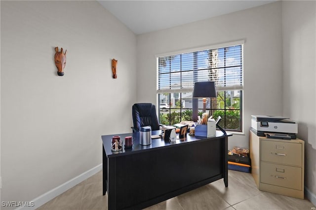 tiled home office featuring baseboards