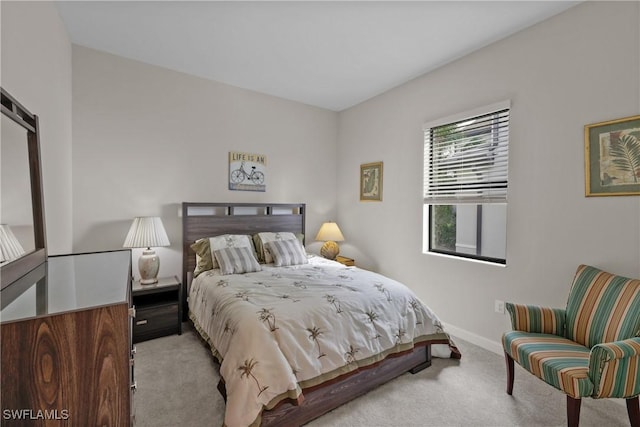bedroom with carpet flooring and baseboards