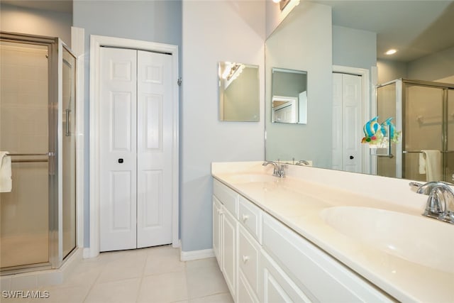 17110 Bridgestone Ct Unit 303, Fort Myers, FL 33908 - bathroom with tile patterned floors, a closet, a shower stall, and a sink