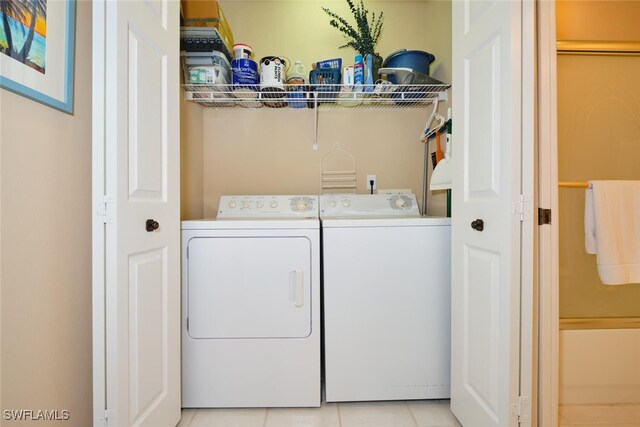 17110 Bridgestone Ct Unit 303, Fort Myers, FL 33908 - clothes washing area with laundry area, light tile patterned flooring, and separate washer and dryer