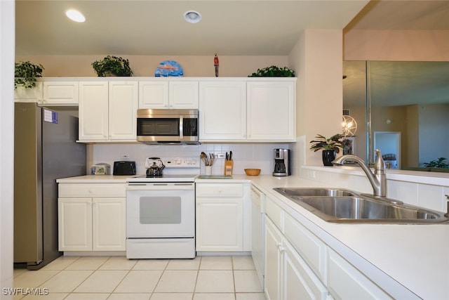 17110 Bridgestone Ct Unit 303, Fort Myers, FL 33908 - kitchen with a sink, white cabinetry, light countertops, and appliances with stainless steel finishes