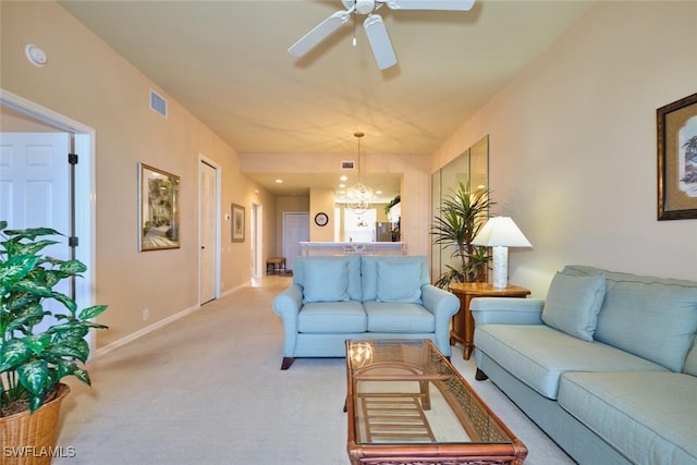 17110 Bridgestone Ct Unit 303, Fort Myers, FL 33908 - living area with visible vents, baseboards, ceiling fan with notable chandelier, and light carpet
