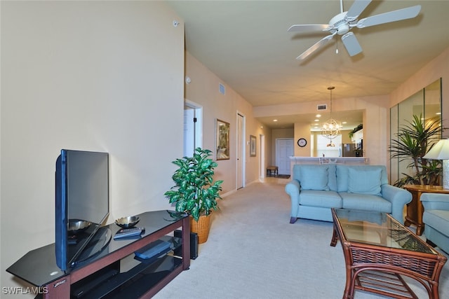 17110 Bridgestone Ct Unit 303, Fort Myers, FL 33908 - carpeted living area with ceiling fan with notable chandelier and visible vents