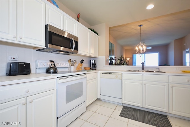 17110 Bridgestone Ct Unit 303, Fort Myers, FL 33908 - kitchen featuring light tile patterned floors, white appliances, a sink, white cabinetry, and decorative backsplash