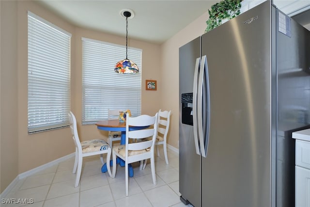 17110 Bridgestone Ct Unit 303, Fort Myers, FL 33908 - dining room with baseboards and light tile patterned flooring