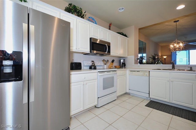 17110 Bridgestone Ct Unit 303, Fort Myers, FL 33908 - kitchen featuring a sink, light countertops, light tile patterned floors, a notable chandelier, and appliances with stainless steel finishes
