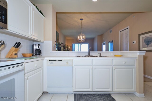 17110 Bridgestone Ct Unit 303, Fort Myers, FL 33908 - kitchen with backsplash, white appliances, light tile patterned flooring, and a sink