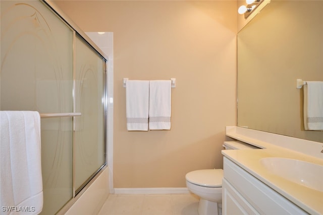 17110 Bridgestone Ct Unit 303, Fort Myers, FL 33908 - bathroom featuring toilet, baseboards, bath / shower combo with glass door, tile patterned floors, and vanity