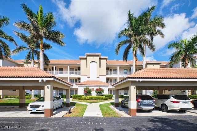 17110 Bridgestone Ct Unit 303, Fort Myers, FL 33908 - view of building exterior featuring covered parking