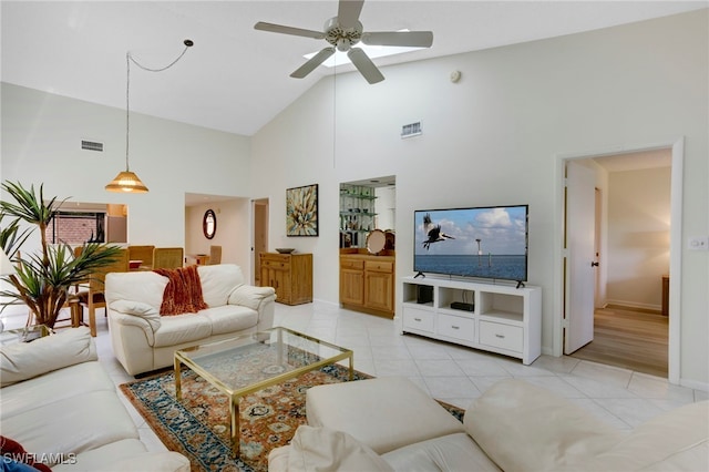 15400 Cedarwood Ln Unit 204, Naples, FL 34110 - living room with high vaulted ceiling, ceiling fan, baseboards, and light tile patterned flooring