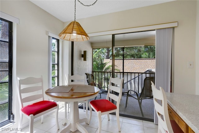 15400 Cedarwood Ln Unit 204, Naples, FL 34110 - dining area with light tile patterned floors