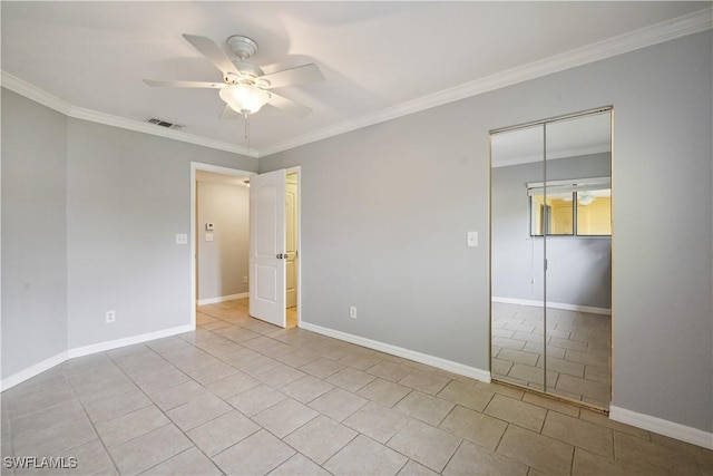 unfurnished bedroom with crown molding, visible vents, and tile patterned flooring