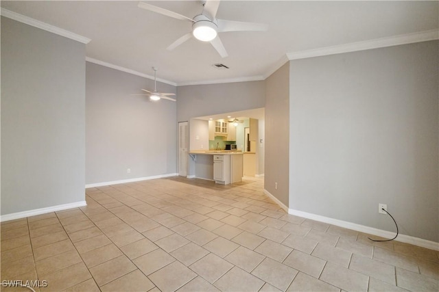 empty room with crown molding, visible vents, ceiling fan, light tile patterned flooring, and lofted ceiling
