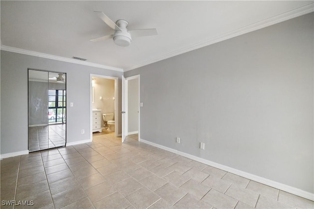 spare room with light tile patterned floors, a ceiling fan, visible vents, baseboards, and ornamental molding