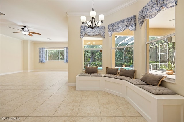 sunroom / solarium featuring a chandelier