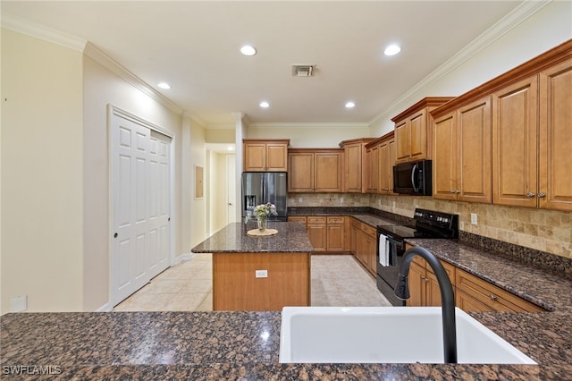 kitchen with black appliances, a sink, a center island, decorative backsplash, and ornamental molding