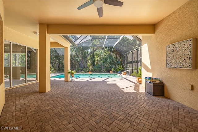view of patio featuring a ceiling fan, an outdoor pool, and a lanai