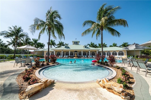 community pool with a patio area