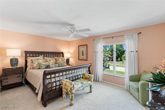 bedroom with light carpet, baseboards, and ceiling fan