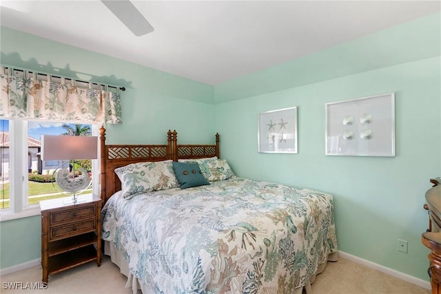 bedroom with carpet, baseboards, and a ceiling fan