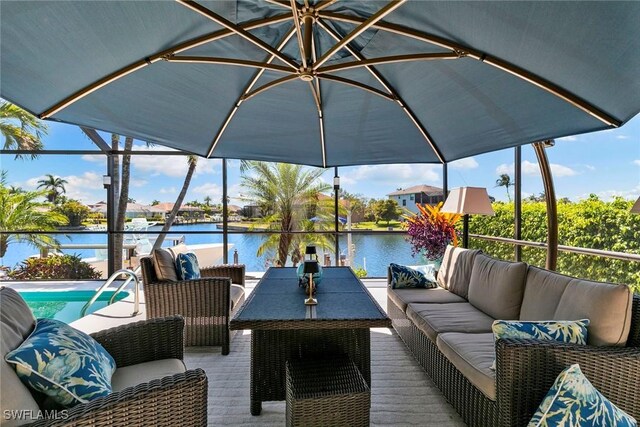 sunroom / solarium with an outdoor hangout area, a water view, and vaulted ceiling