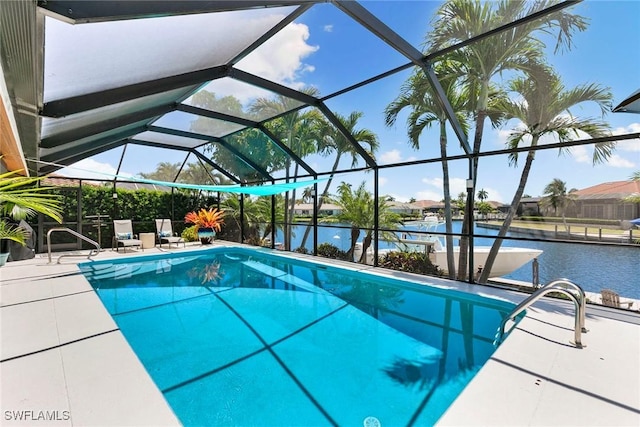 swimming pool featuring a water view, a lanai, and a patio area