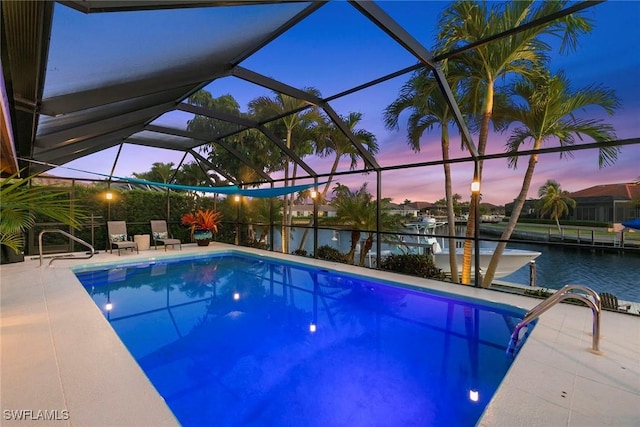 outdoor pool featuring boat lift, a boat dock, a water view, and a lanai