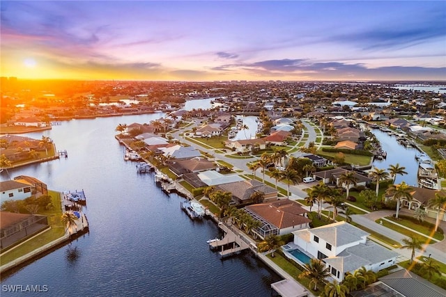 aerial perspective of suburban area with a nearby body of water