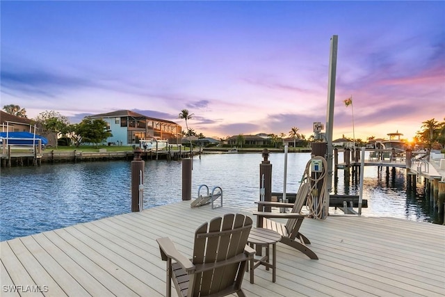 dock area featuring a water view and a residential view