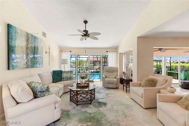 living room featuring ceiling fan and light colored carpet