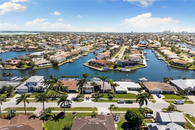 aerial view of residential area with a nearby body of water
