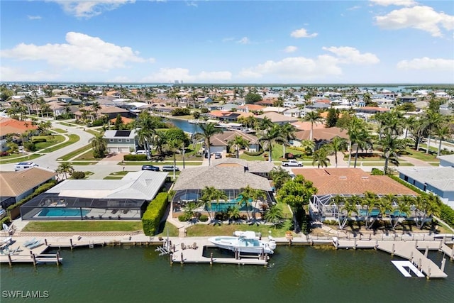 aerial view of residential area with a large body of water