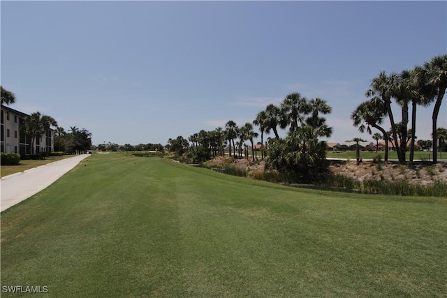 surrounding community featuring a yard