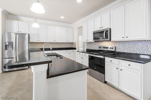 kitchen with stainless steel appliances, a sink, crown molding, white cabinets, and decorative light fixtures