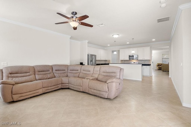 living area featuring light tile patterned floors, a ceiling fan, ornamental molding, recessed lighting, and baseboards