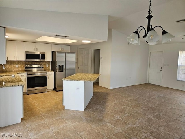 417 NW 18th Pl, Cape Coral, FL 33993 - kitchen with a notable chandelier, appliances with stainless steel finishes, visible vents, and a sink