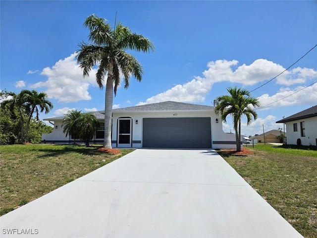417 NW 18th Pl, Cape Coral, FL 33993 - ranch-style home with an attached garage, concrete driveway, stucco siding, and a front yard