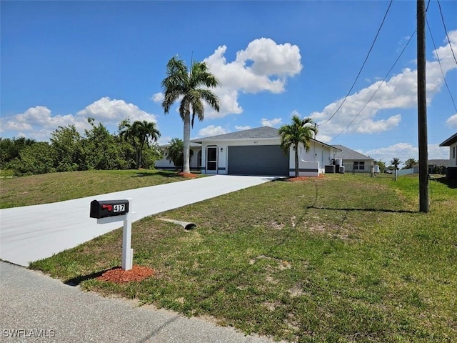 417 NW 18th Pl, Cape Coral, FL 33993 - ranch-style home featuring driveway, a garage, and a front yard