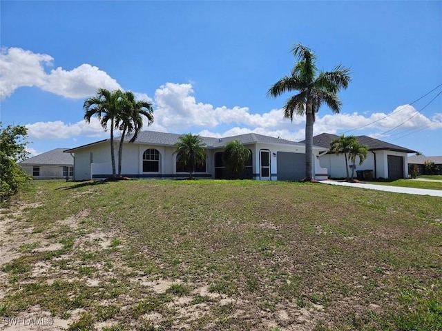 417 NW 18th Pl, Cape Coral, FL 33993 - single story home featuring an attached garage, driveway, and a front yard