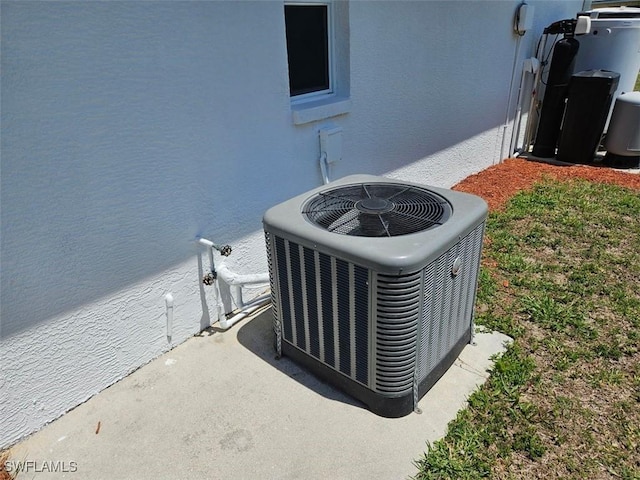 417 NW 18th Pl, Cape Coral, FL 33993 - details featuring cooling unit and stucco siding