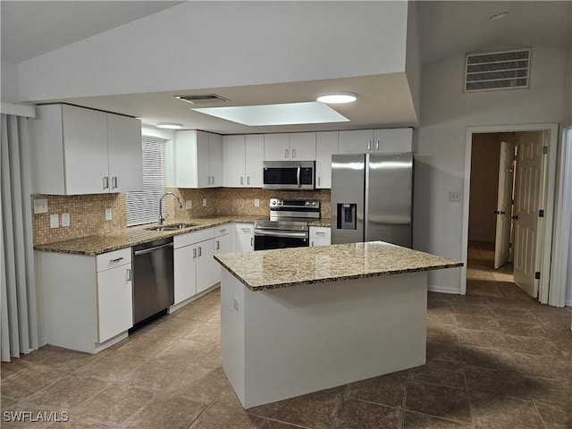 417 NW 18th Pl, Cape Coral, FL 33993 - kitchen with appliances with stainless steel finishes, visible vents, tasteful backsplash, and a sink