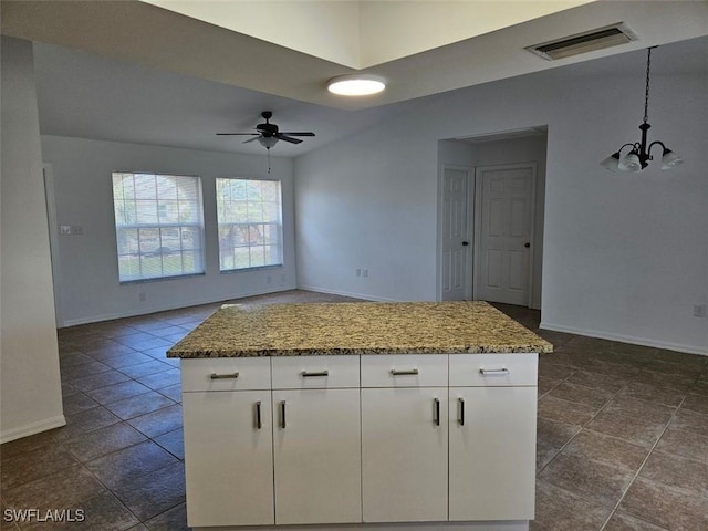 417 NW 18th Pl, Cape Coral, FL 33993 - kitchen with white cabinets, visible vents, baseboards, and ceiling fan with notable chandelier