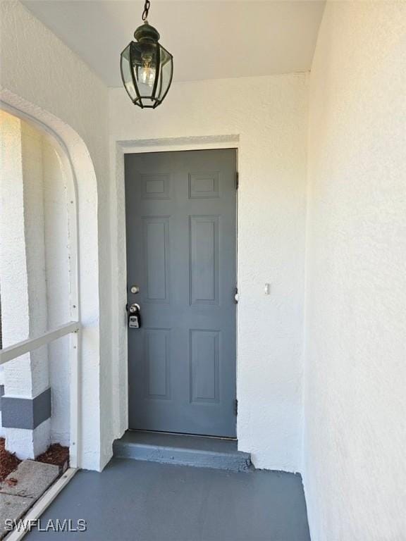 417 NW 18th Pl, Cape Coral, FL 33993 - property entrance featuring stucco siding