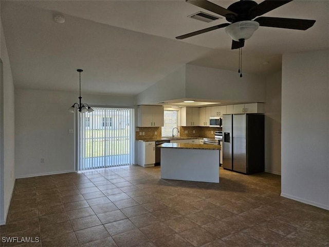 417 NW 18th Pl, Cape Coral, FL 33993 - kitchen with a sink, visible vents, white cabinets, baseboards, and appliances with stainless steel finishes