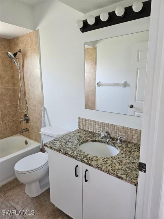 417 NW 18th Pl, Cape Coral, FL 33993 - full bath with bathtub / shower combination, toilet, tile patterned flooring, and vanity