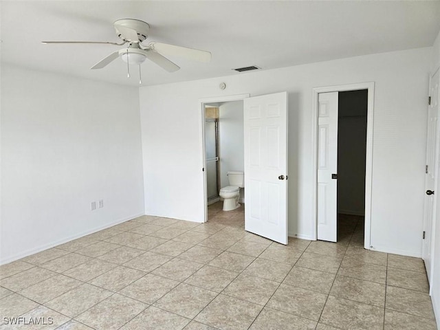 417 NW 18th Pl, Cape Coral, FL 33993 - unfurnished bedroom with a walk in closet, baseboards, light tile patterned floors, and visible vents