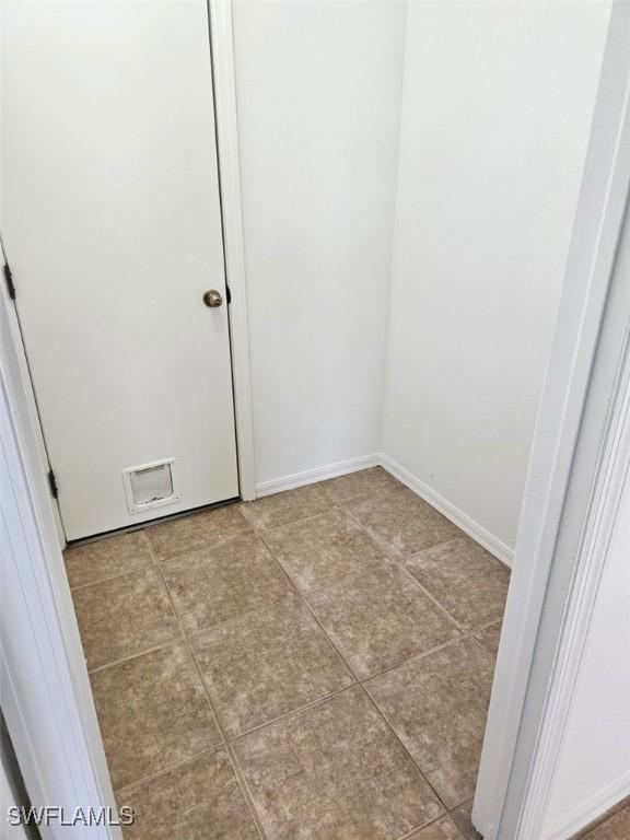 417 NW 18th Pl, Cape Coral, FL 33993 - interior space with light tile patterned floors and baseboards