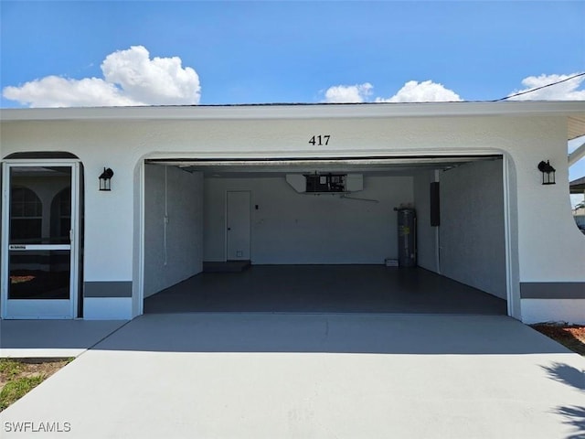 417 NW 18th Pl, Cape Coral, FL 33993 - garage with electric water heater and driveway