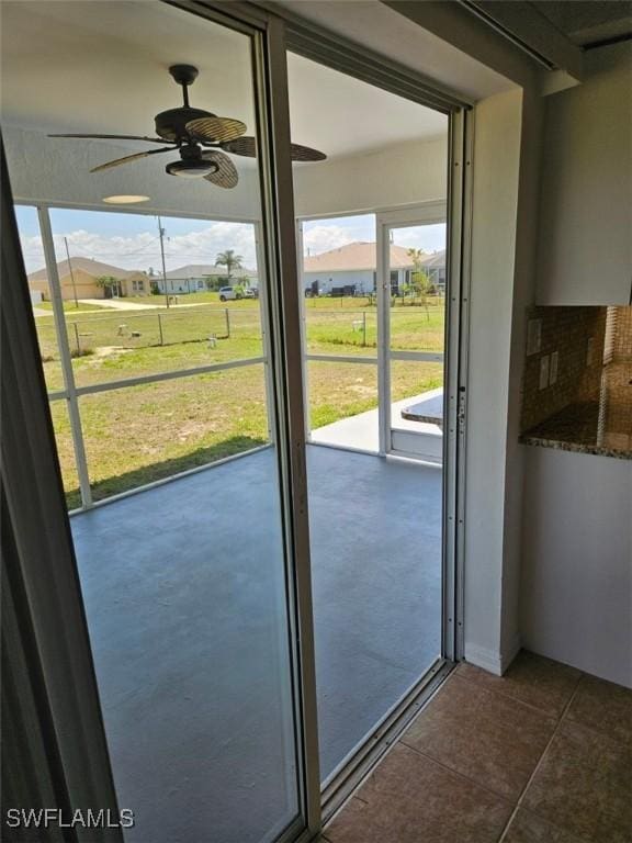417 NW 18th Pl, Cape Coral, FL 33993 - entryway with plenty of natural light, dark tile patterned flooring, and a ceiling fan